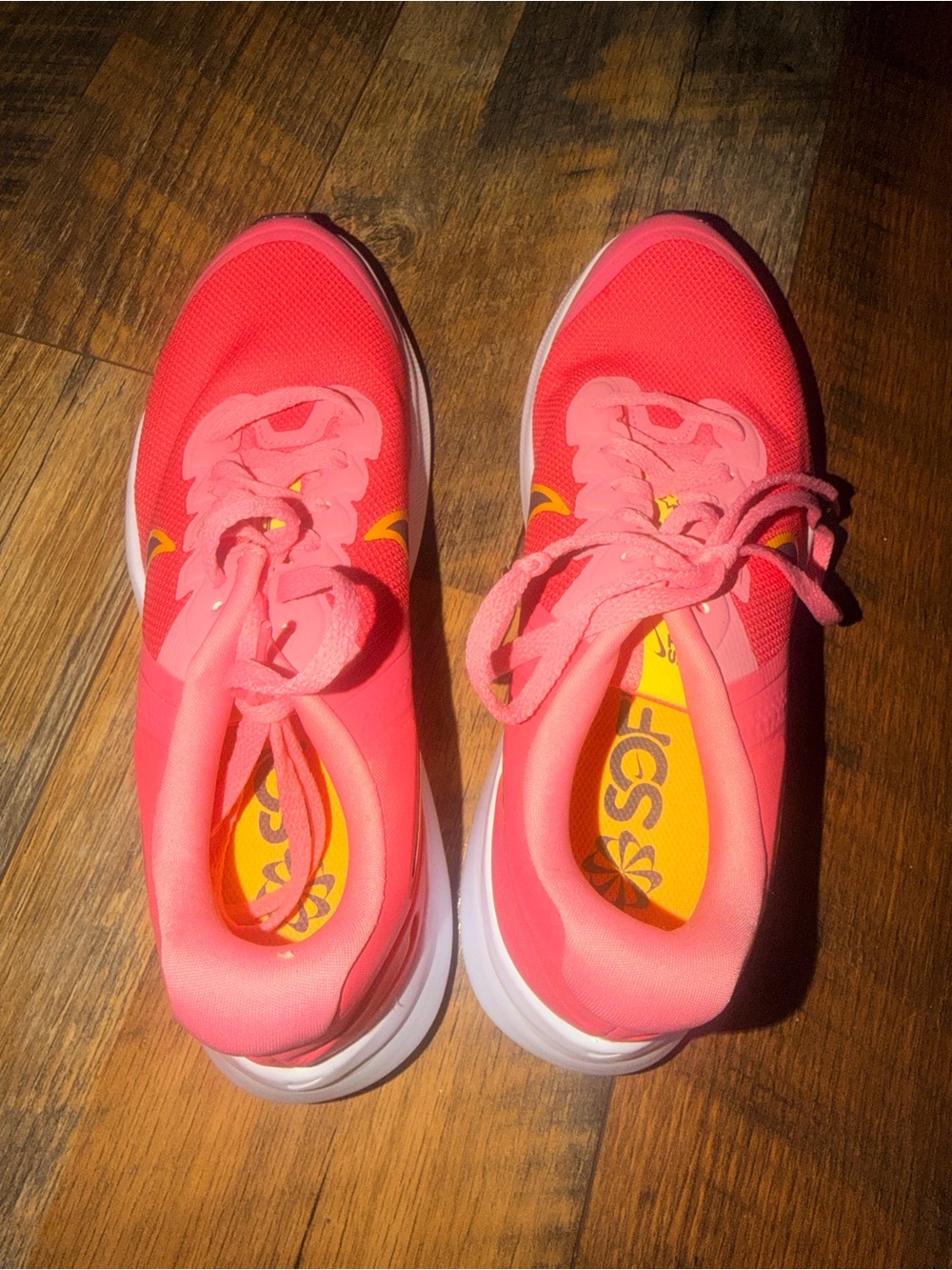 Bright Coral Nike Athletic Sneakers with Yellow Accents